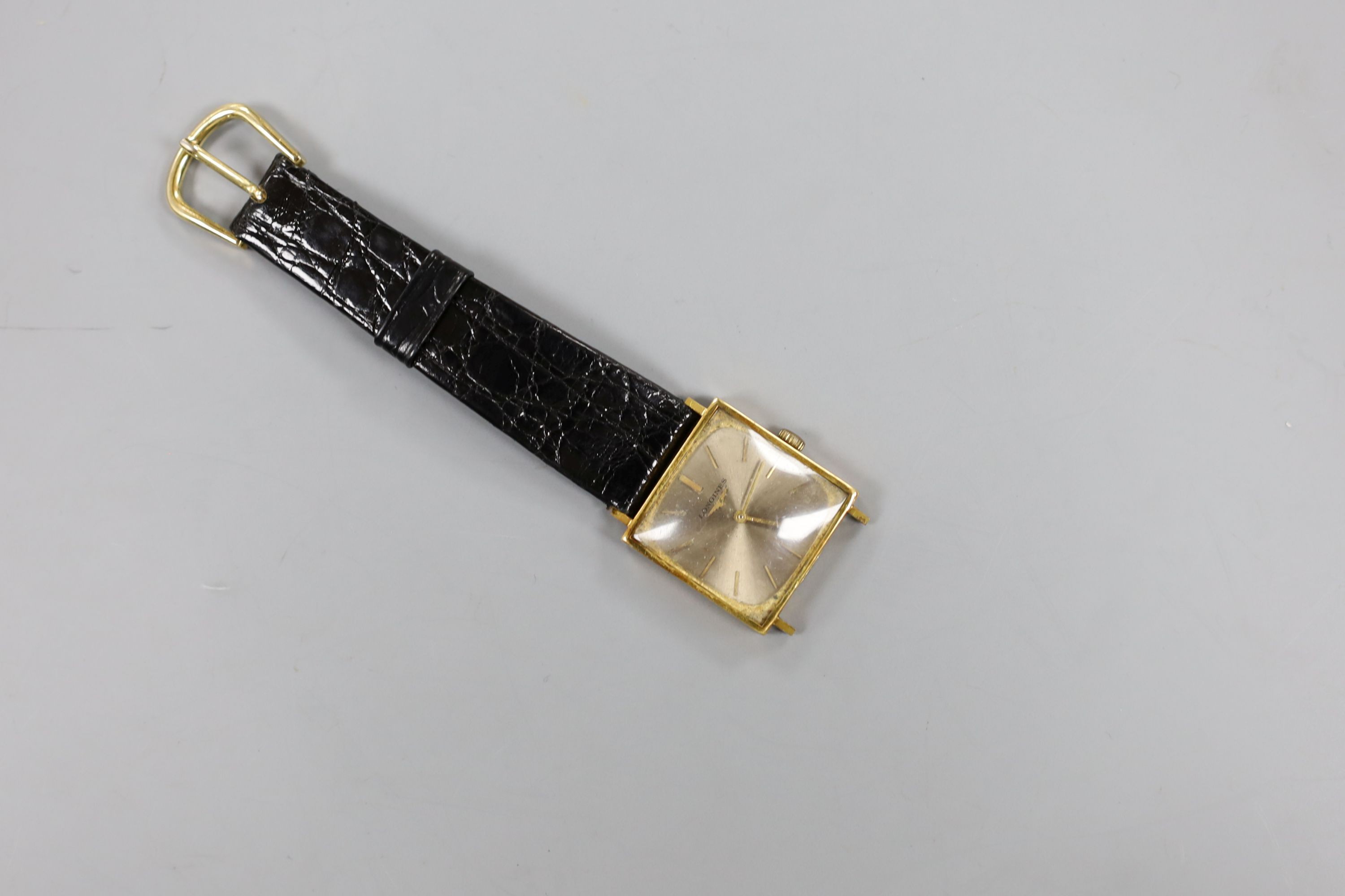 A gentleman's 1960's 18ct gold Longines manual wind dress wrist watch (part of strap missing), gross weight 22.5 grams.